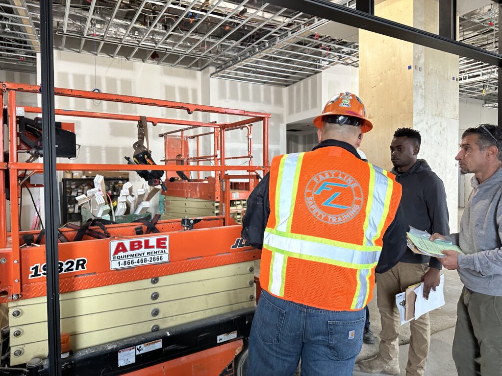 Scissor and Boom Lift Training being taught by our instructor to two other construction workers