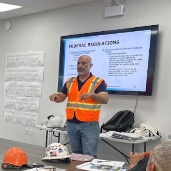 Fast Line Safety Instructor Teaching about Site Safety in Classroom