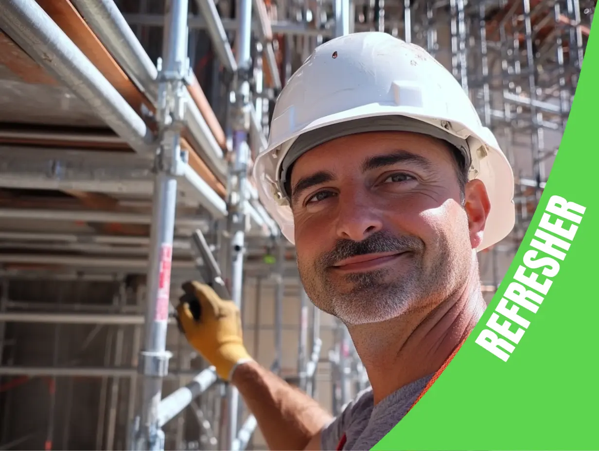 A construction worker in a white hard hat and orange harness smiles confidently, demonstrating his expertise as a Suspended Scaffold Supervisor while diligently working on the scaffold. With a proud banner expressing this is a refresher course.